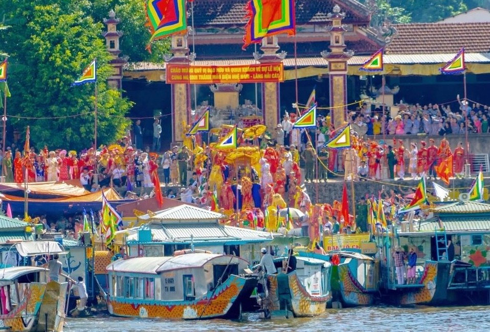 Colorful boat procession during the Hon Chen Festival in Hue