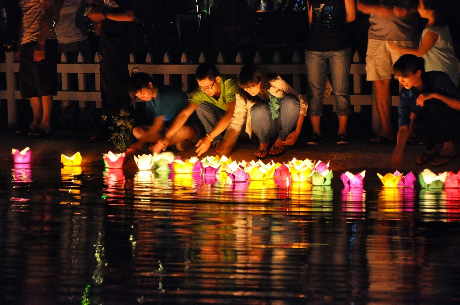 Colorful lantern festival and floating candles on the river in Hoi An