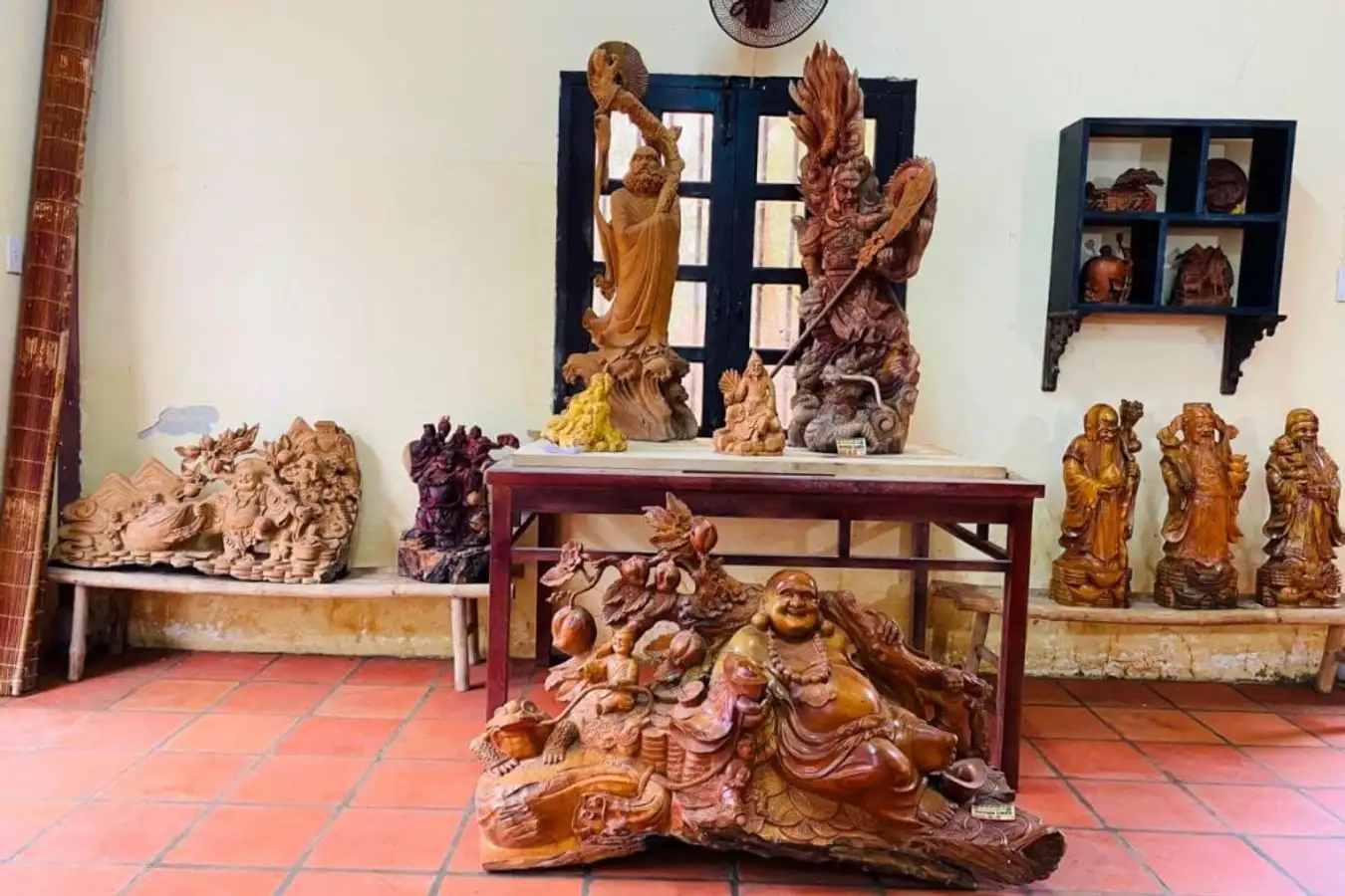 Display of handcrafted wooden products including sculptures and home decor