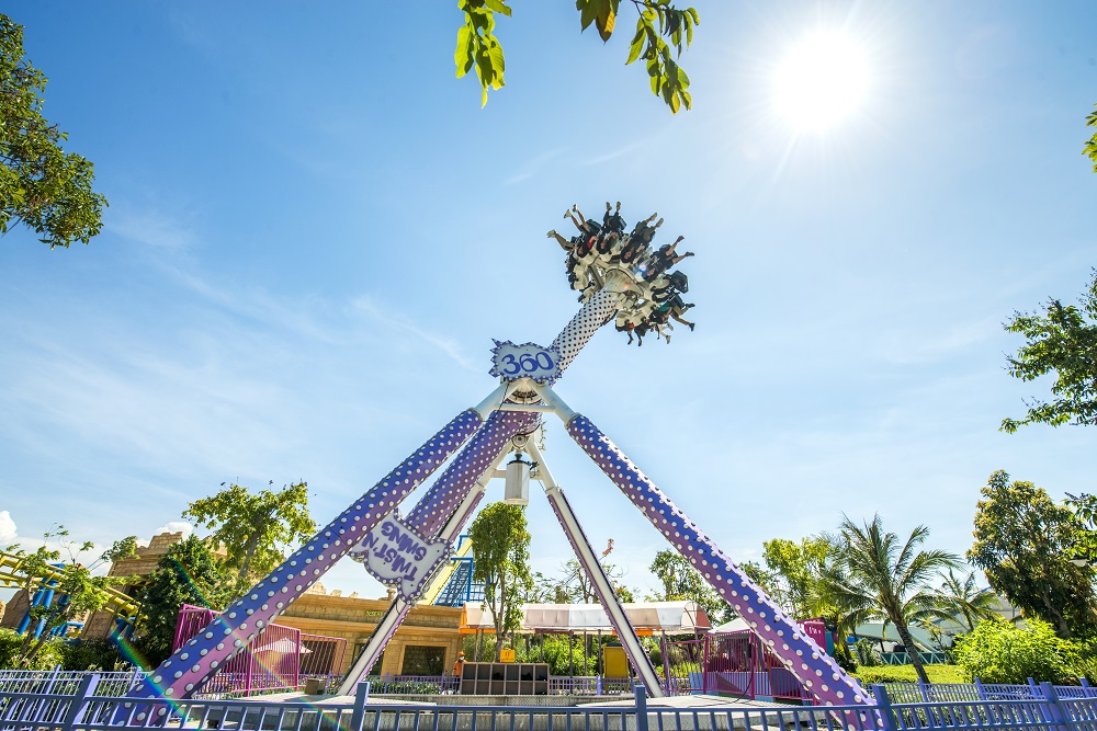 Family enjoying a fun day together at an outdoor amusement park