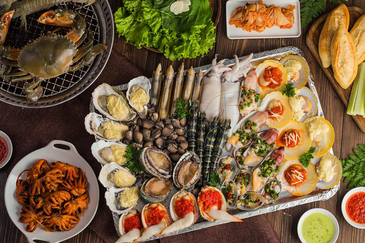 Fresh seafood dishes served at a beachfront restaurant with an ocean view.