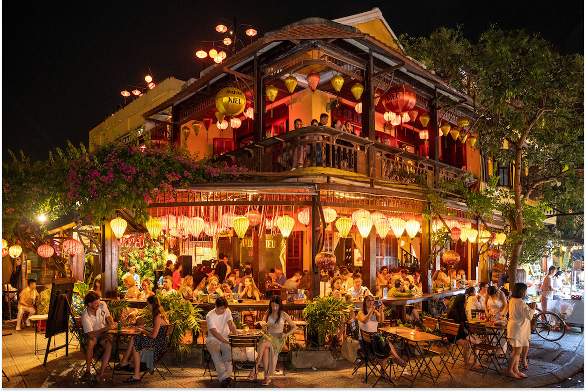 Busy evening atmosphere at the Hoi An night market riverside
