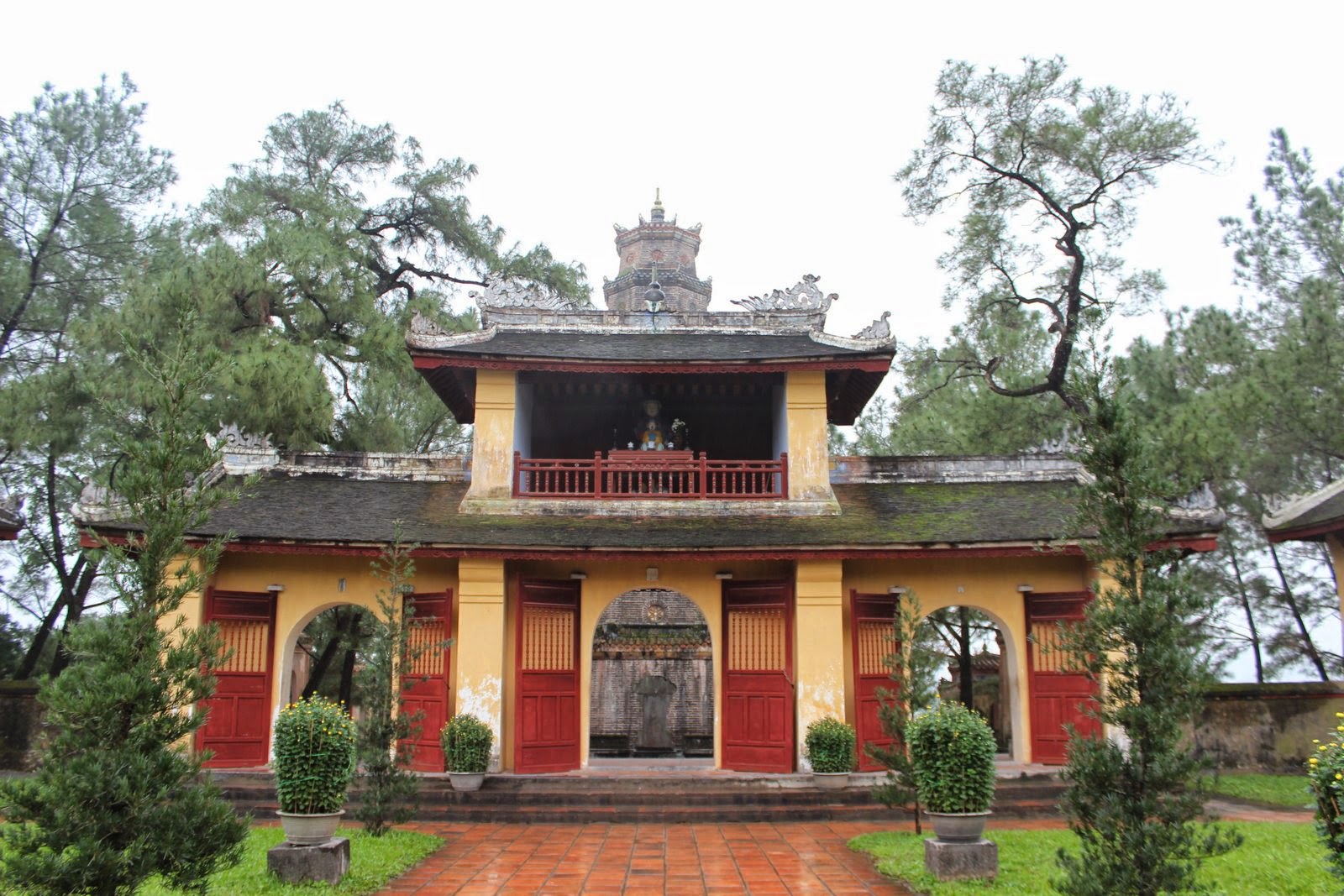 Main entrance gate with visitor information signage