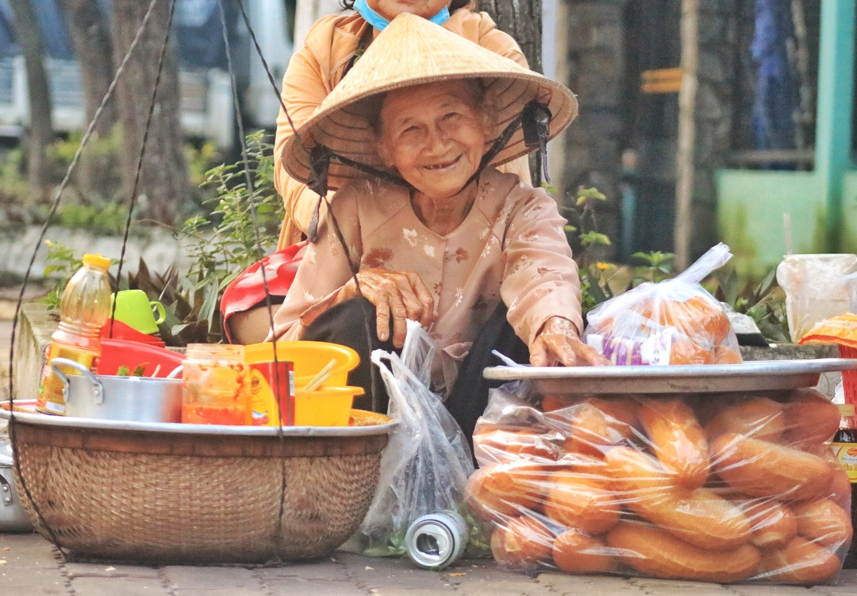 Street food vendor making banh mi in Ho Chi Minh City