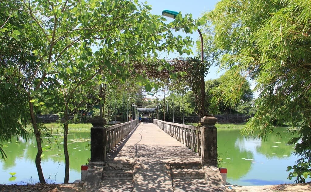 Traditional pavilion and small island within Tinh Tam Lake in Hue