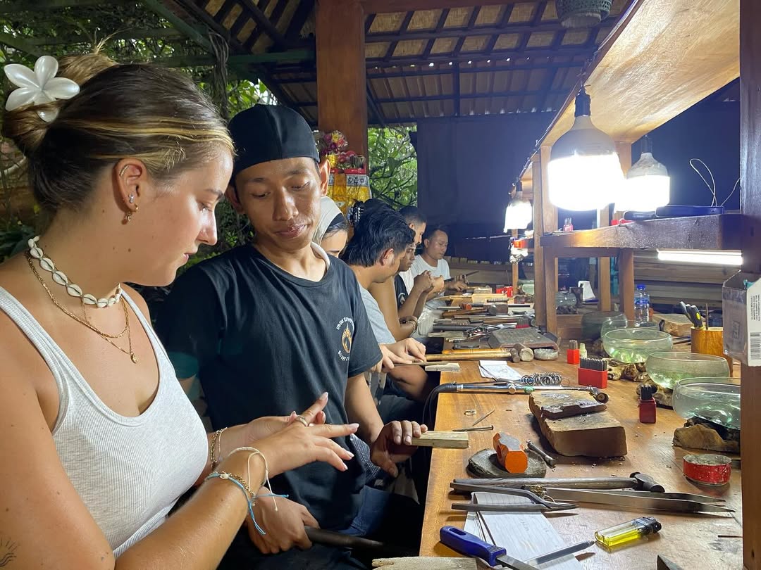 Traveler learning traditional silversmith techniques in Vietnam
