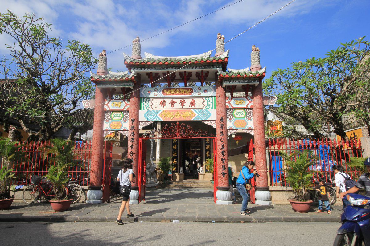 Walking through historic streets during Temple Hopping in Hoi An