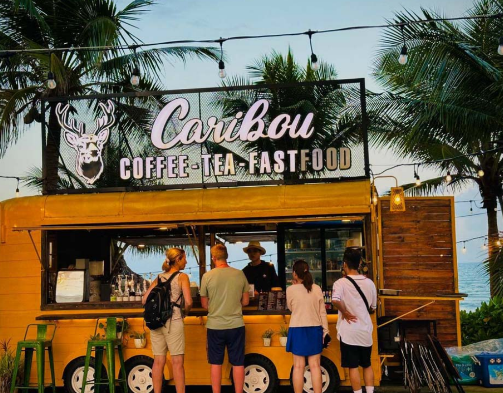 Caribou Food Truck offers refreshing drinks and casual bites in a colorful beachside setting