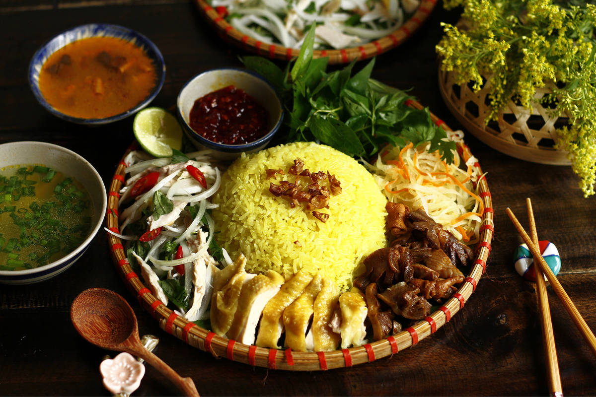 Hoi An Chicken Rice – Fragrant turmeric rice served with tender shredded chicken and fresh local herbs