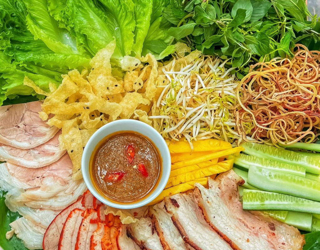 Rice paper, sliced pork, herbs, and vegetables come together in this interactive Central Vietnamese specialty.