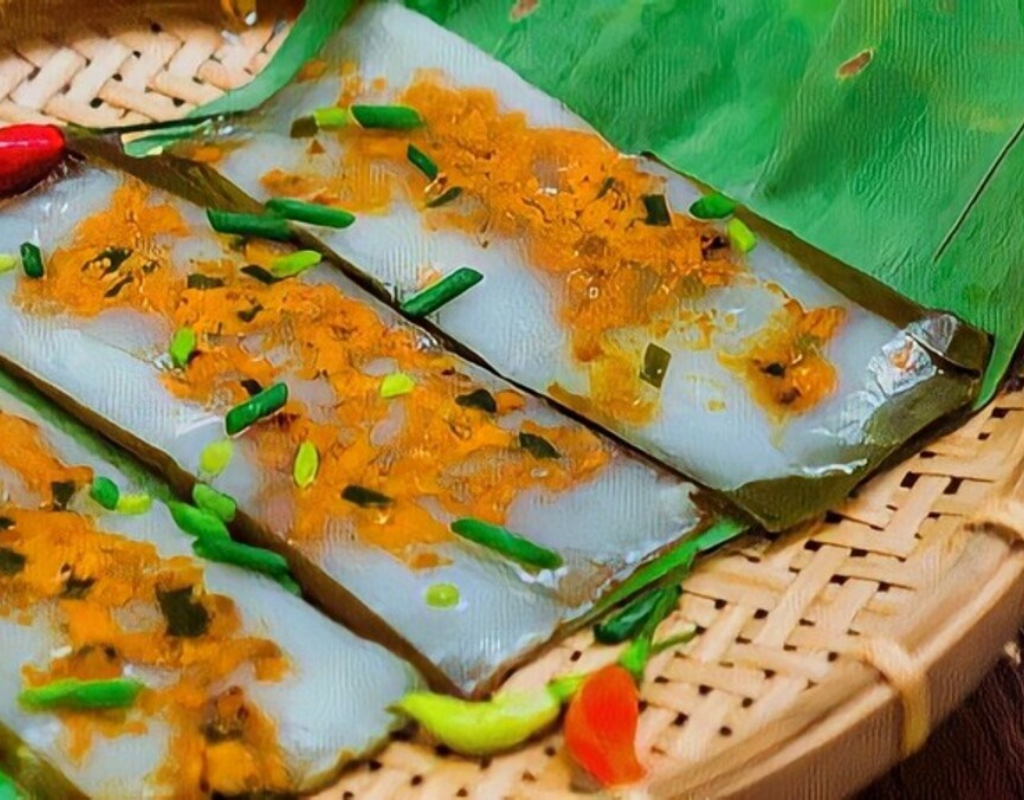 Soft rice cakes wrapped in banana leaves reveal a delicate shrimp filling and subtle savory flavors.